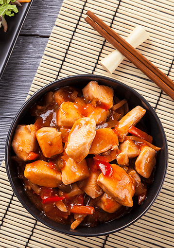 sweet n sour chicken in black bowl